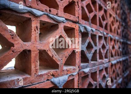 Patterned wall of blocks of red bricks. background texture Stock Photo