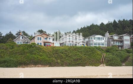 Front view of house on the beach at Pacific coastal in US, real estate with space for text. Coastal beach houses and sandy beach. Beach luxury houses Stock Photo