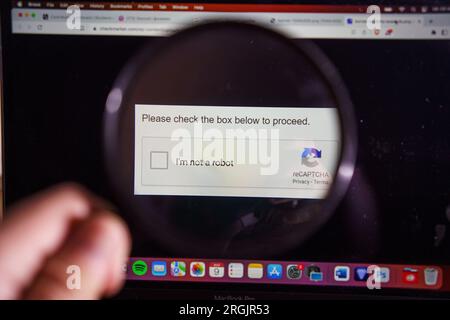 reCAPTCHA on windows screen. Checkmark to prove that you are not robot, but human Stock Photo