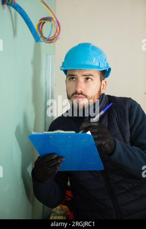 confident service man taking notes Stock Photo