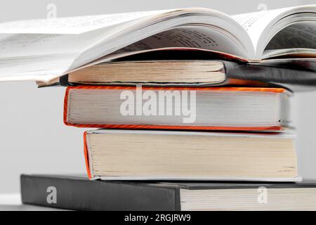 Open book on a stack of books close up. School concept Stock Photo