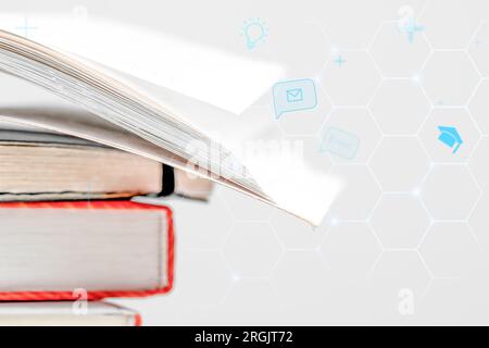 E book digital learning. Open book and scattered shapes and symbols. Elearning concept. Stock Photo