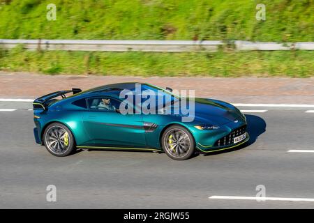 2022 Green ASTON MARTIN Vantage F1 Edition V8 Auto, 4.0 litre twin-turbocharged V8 engine; travelling at speed on the M6 motorway in Greater Manchester, UK Stock Photo