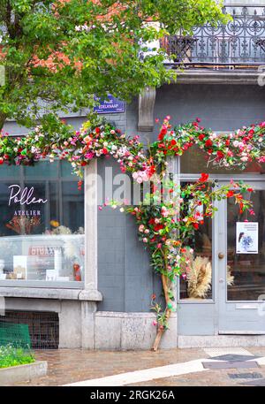 Artificial flowers decorating front entrance of "Pollen Atelier" in Ixelles, Brussels, Belgium. Stock Photo