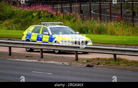 Dundee, Tayside, Scotland, UK. 10th Aug, 2023. UK Weather: On a cloudy day with considerable humidity and temperatures around 22°C. Police Scotland officers are carrying out their daily responsibilities as they drive along Dundee's Kingsway West Dual Carriageway. Dundee has Scotland's highest crime rate, surpassing Glasgow. Credit: Dundee Photographics/Alamy Live News Stock Photo