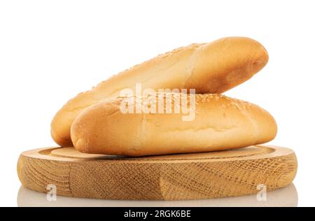 Two delicious fragrant rolls on a round wooden tray, close-up, isolated on white. Stock Photo