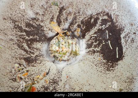 Food waste in the kitchen sink close-up as a background, blockage in the kitchen sink, kitchen Stock Photo