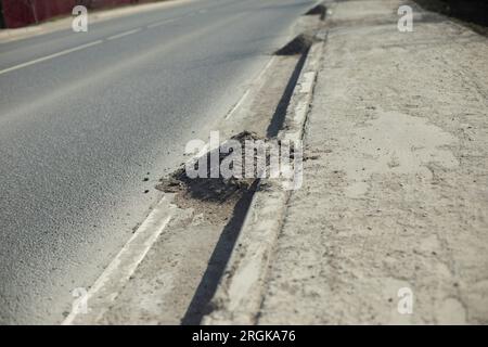 Dust on road. Pile of garbage on side of road. Cleaning track. Dirt on highway. Stock Photo