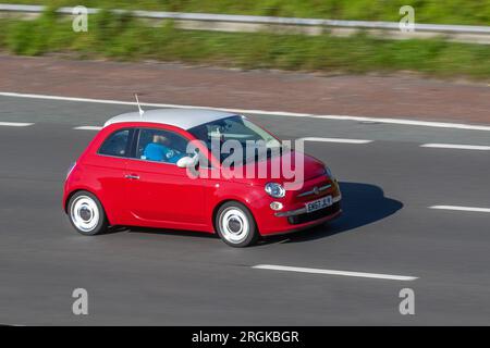 2015 Red FIAT Vintage 57, Start/Stop Hatchback 1242 cc  travelling at speed on the M6 motorway in Greater Manchester, UK Stock Photo