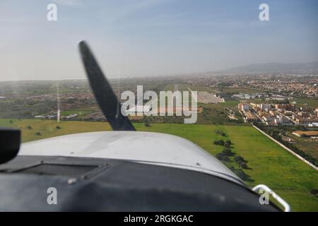 Stock photo of the views from the window of light aircraft while taking off. Stock Photo