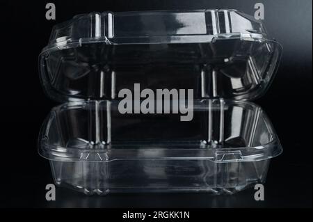 Transparent open food box front view isolated on black background Stock Photo