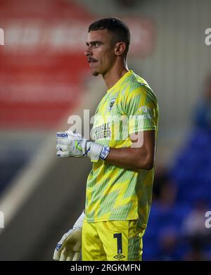 AFC Wimbledon goalkeeper Nik Tzanev in action during the Carabao Cup first round match at the Cherry Red Records Stadium, London. Picture date: Wednesday August 9, 2023. Stock Photo