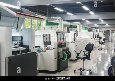 production line for printed circuit board manufacturing mounted in workshop Stock Photo