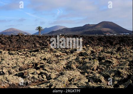 Aa lava and volcanos. Los Volcanes Natural Park, Lanzarote Island, Las Palmas, Canary Islands, Spain. Stock Photo