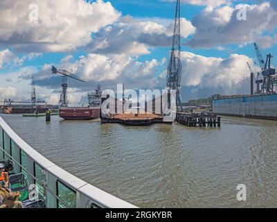 Panoramic picture from port Rotterdam with transport ships during daytime Stock Photo