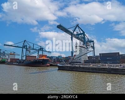 Panoramic picture from port Rotterdam with transport ships during daytime Stock Photo