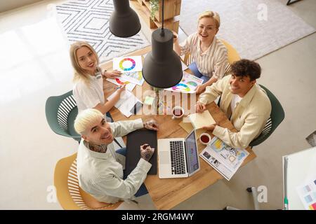 Team of graphic designers working at table in office Stock Photo
