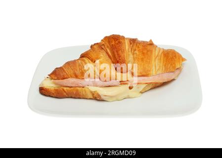 Ham and meleted cheese croissant on a plate isolated against white Stock Photo