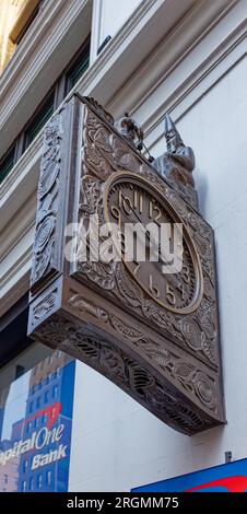 Midtown South: The Wizard of Park Avenue, perched atop The Silk Clock on the side of the Schwarzenbach Buildings, animates to strike the hour. Stock Photo