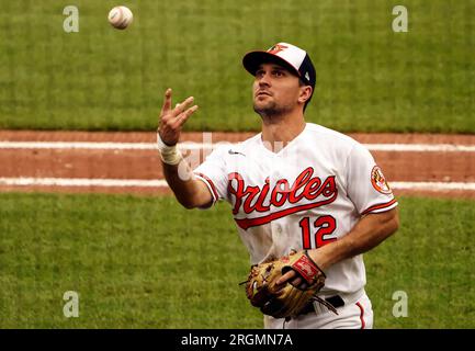 Baltimore Orioles' Adam Frazier (12) flips the ball to first during a  baseball game against the Tampa Bay Rays Sunday, July 23, 2023, in St.  Petersburg, Fla. (AP Photo/Scott Audette Stock Photo - Alamy