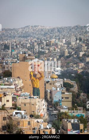 Amman, Jordan - November 1, 2021: Cityscape with huge mural seen from citadel hill Stock Photo