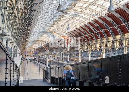 evening sun beam through arch roof top glasses onto Paddington station platform, GWR train is waiting for evening commuter passengers London UK Stock Photo