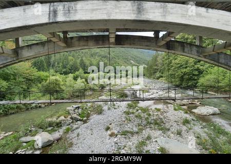 Canal bridge on river Serio in Seriana Valley, Villa d'Ogna, Lombardy, Italy Stock Photo
