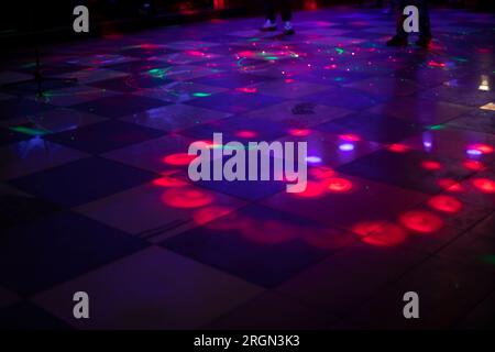 Music and color. Dance floor. Disco and floor lighting. Spotlights of different colors. Stock Photo