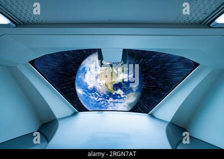 Window view of alien spaceship. UFO or unidentified flying objects. Alien invasion. Space travel. Alien spaceship and extraterrestrial technology. Stock Photo