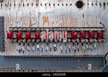 The fuses on an abandoned electrical panel at a rail yard Stock Photo