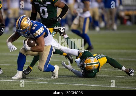 Winnipeg Blue Bombers' Greg McCrae (29) and Brady Oliveira (20) celebrate  Oliveira‚Äôs touchdown against the Edmonton Elks during first half CFL  action in Winnipeg on October 8, 2022. Oliveira will make his