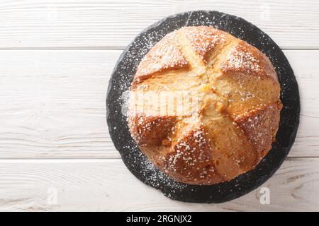 Orange Anise Sugared Easter Brioche Mouna closeup on the wooden table. Horizontal top view from above Stock Photo