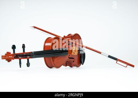 Violin with bow isolated on white background. Stock Photo