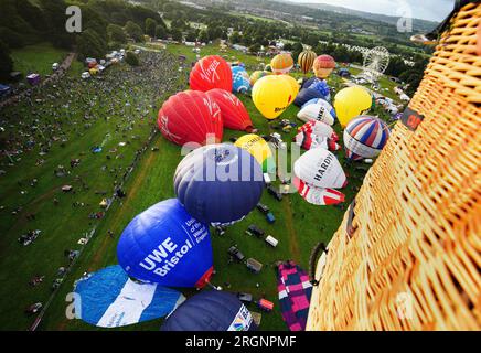 Hot air balloons are inflated during the mass ascent at the Bristol International Balloon Fiesta 2023. Picture date: Friday August 11, 2023. Stock Photo