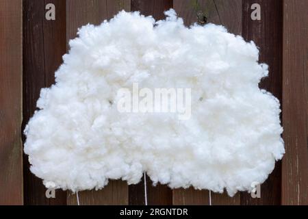 The artificial cloud is made of cotton wool. Place for writing. Copy space. Stock Photo