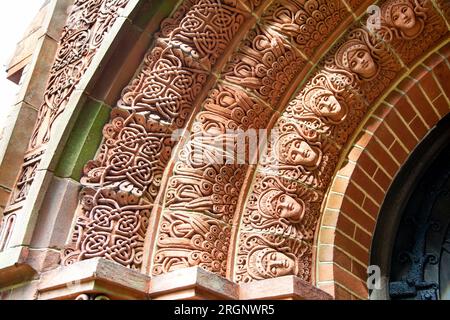 Celtic and art nouveau style relief in the doorway archivolt of the Watts Chapel, Compton, Surrey, England Stock Photo