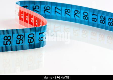 Measuring tape of the tailor isolated on white background Stock Photo