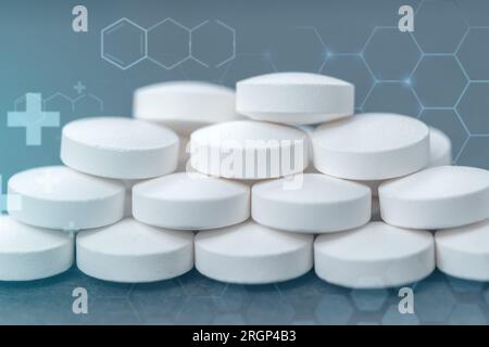 Abstract pills wall, capsule on glowing blue background. Stock Photo