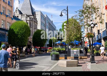 People walking along Government Street in downtown Victoria, BC, Canada in the summer. Stock Photo