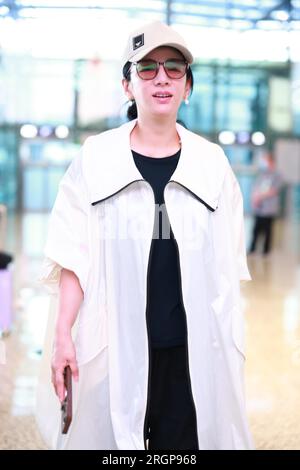 Chinese actress and singer Huang Yi appears at the airport in