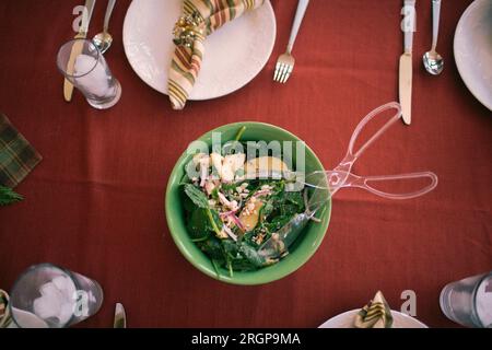 A top down view of salad on finely decorated table. Stock Photo