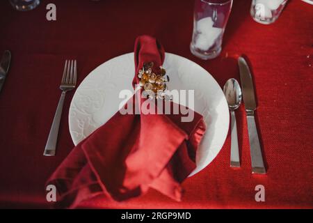 A dining room table is decorated for a family dinner. Stock Photo