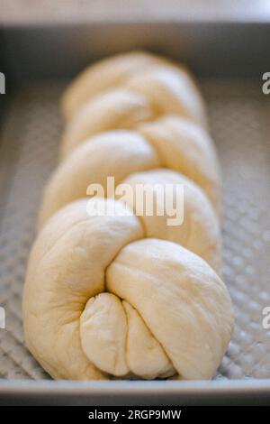 A decorative bread is braided and ready to cook in the oven. Stock Photo