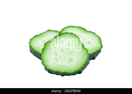 Juicy fresh sliced cucumbers isolated on white background Stock Photo