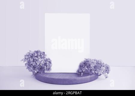 Blank Greeting Card Invitation Mockup. Front view. Dry Flowers Modern Wooden Plate, Paper Mock Up on Violet Table. Copy Space. Minimal Business Brand Stock Photo