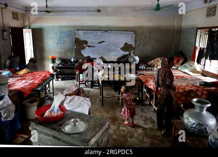 Bandarban, Bandarban Sadar, Bangladesh. 10th Aug, 2023. August 11, 2023. Chittagong, Bangladesh : Due to the flood water receding from the roads in different areas of Bandarban, the picture is emerging in the order of damage. Many people are sheltered in school due to house collapse. Due to heavy rainfall for six consecutive days, the water of Sangu and Matamuhuri rivers crossed the limit, causing floods in almost all upazilas of Bandarban.According to the sources of the flood control room of the district administration, eight people hav Stock Photo