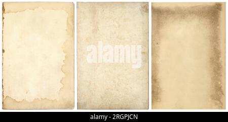three stained blank old book pages or sheets of vintage antique paper, textured retro collage art backgrounds with ripped edges isolated on white Stock Photo
