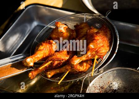 Fried chicken in a steet food stand in Klong Toei Market in Bangkok. Stock Photo