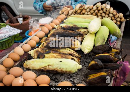 Bananas on a grill at a street food stall in Bangkok. Stock Photo