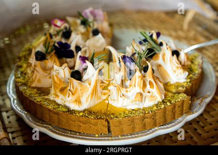 Lemon pie with blueberries in a pastry shop in the city of Paris in France. Stock Photo